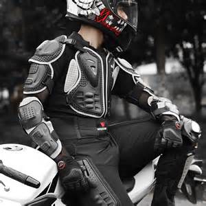 Moto rider wearing protective motorcycle boots