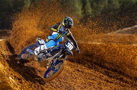 Motocross rider performing a cornering maneuver