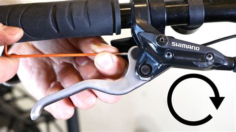 Close-up of Shimano brake lever with adjustment screws