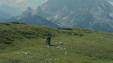 mountain biker riding on a scenic trail in the Dolomites