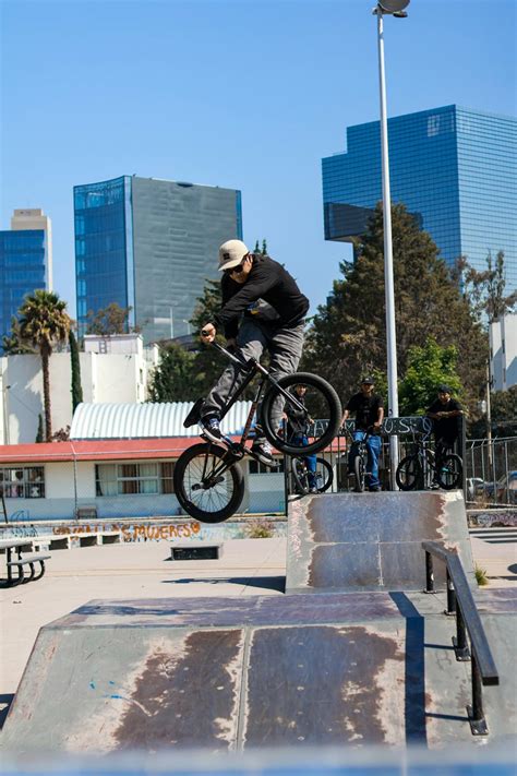 BMX rider performing a trick in an Italian city