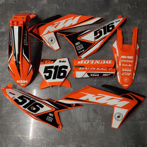 Close-up of KTM dirt bike plastics with custom graphics